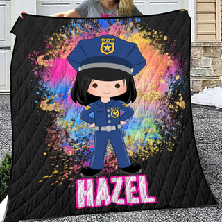 a woman holding a blanket with a picture of a police officer on it