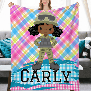 a girl holding up a personalized blanket