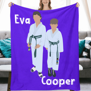 a woman holding up a purple towel with two men in karate uniforms