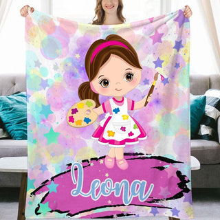 a girl with a paintbrush holding a personalized blanket