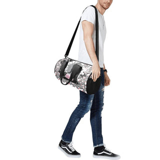 a man carrying a duffel bag with a skateboard on it