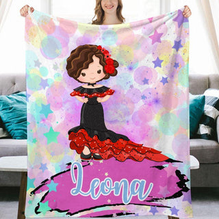 a woman holding up a personalized blanket