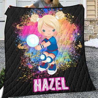 a woman holding a blanket with a picture of a girl on it