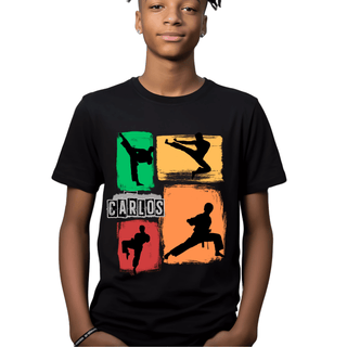 a young boy wearing a black shirt with a colorful graphic of a man doing a