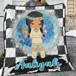 a girl holding up a blanket with a picture of a native american girl on it