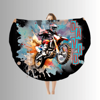 a woman holding up a colorful motorcycle blanket