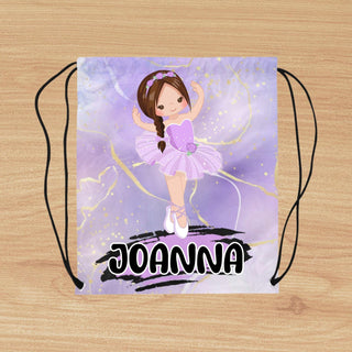 a drawstring bag with a picture of a ballerina on it