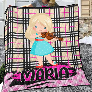 a girl is holding a violin on a blanket