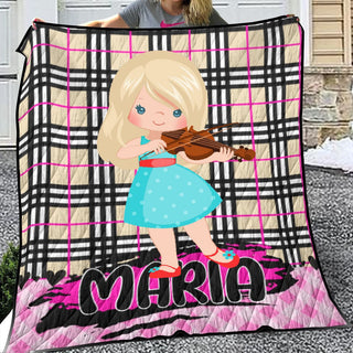 a girl is holding a violin on a blanket