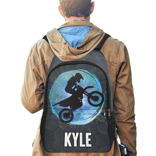 a man wearing a backpack with a picture of a motorcyclist on it