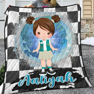 a girl holding a quilt with the name ariayah on it