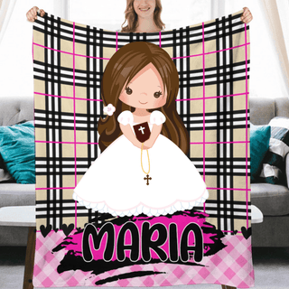 a woman holding up a blanket with a picture of a woman in a white dress