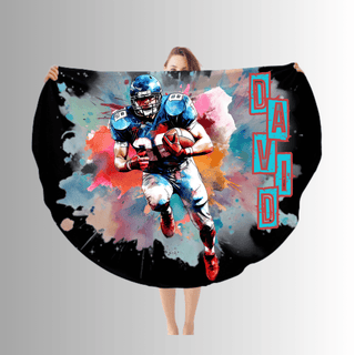 a woman is holding a blanket with a picture of a football player