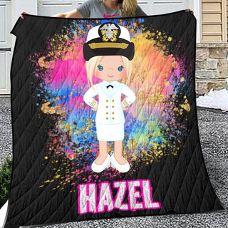 a woman holding a blanket with a picture of a girl in a sailor's