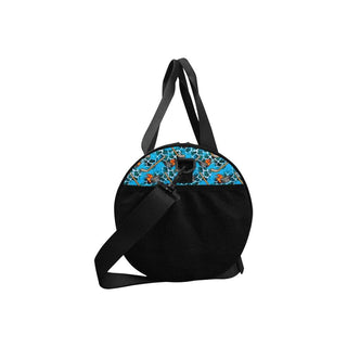 a black and blue bag with a cat on it