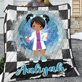 a girl holding a quilt with a picture of a doctor on it