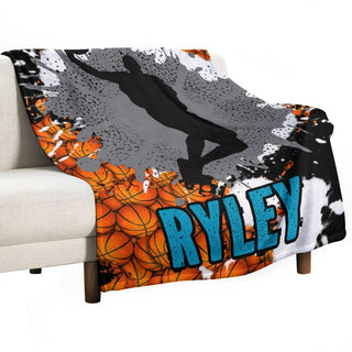 a couch with a basketball blanket on top of it