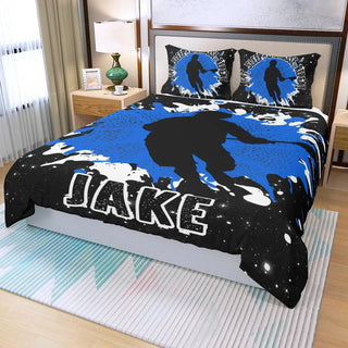 a bed covered in a blue and black bed spread