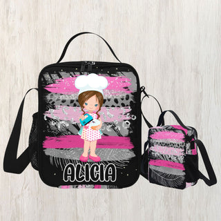 a little girl with a chef hat and apron on a pink and black lunch bag