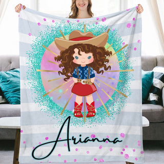 a woman holding up a personalized blanket