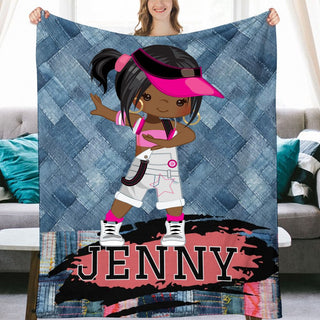 a girl holding up a blanket with the name jenny on it