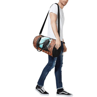 a man carrying a duffel bag with a design on it