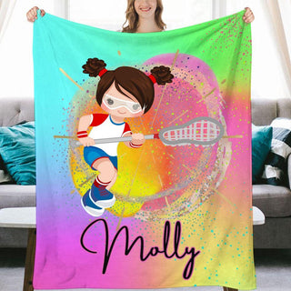 a woman holding a colorful blanket with a picture of a girl holding a tennis rack