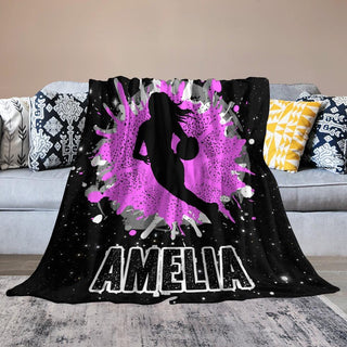 a black and purple blanket with a basketball player on it