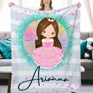 a woman holding up a personalized princess blanket