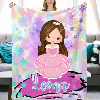 a girl holding up a personalized princess blanket