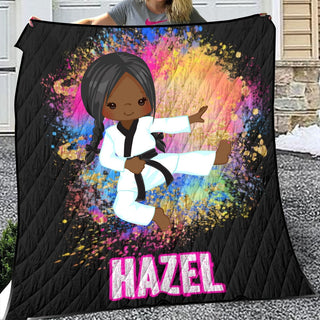 a woman holding a blanket with a picture of a black girl on it