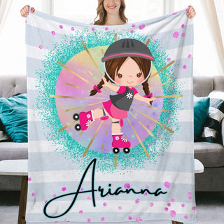 a girl holding up a personalized blanket