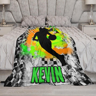 a bed with a basketball themed comforter on it