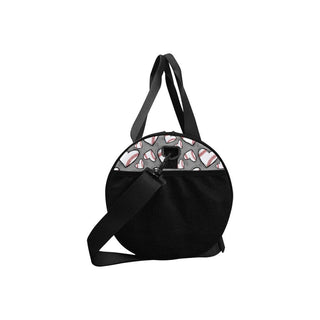 a black duffel bag with baseballs on it