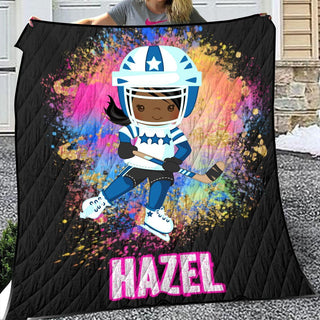 a girl holding a blanket with a picture of a football player on it