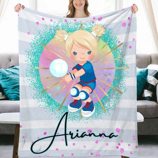 a woman holding up a personalized blanket with a picture of a girl holding a