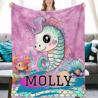 a woman holding up a personalized beach towel