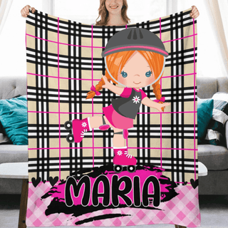 a girl is holding up a personalized blanket