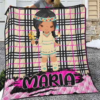 a woman holding a blanket with a picture of a native american girl on it