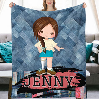 a girl holding up a personalized blanket