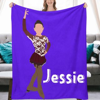 a woman holding up a purple towel with a picture of herself on it