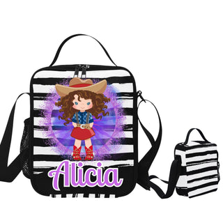 a black and white striped bag with a picture of a girl wearing a cowboy hat