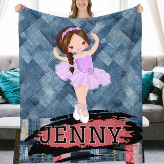 a woman holding a blanket with a picture of a ballerina