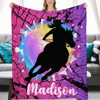 a woman holding up a personalized horse blanket