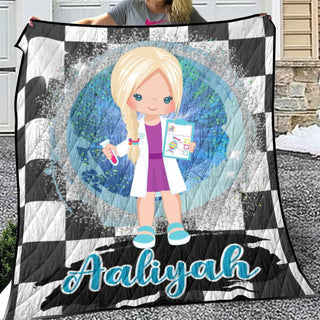 a girl holding up a personalized quilt