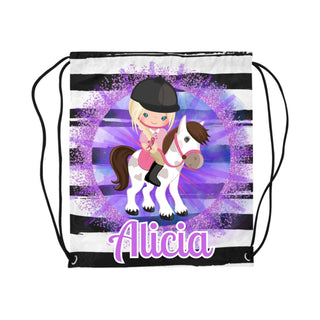 a drawsack bag with a girl riding a horse