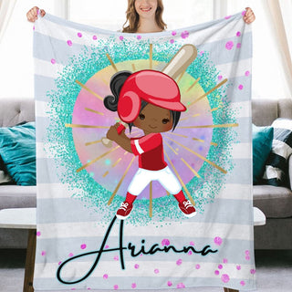 a woman holding up a personalized baseball blanket