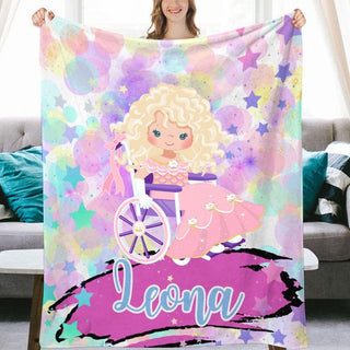 a woman holding a blanket with a picture of a blonde girl on it