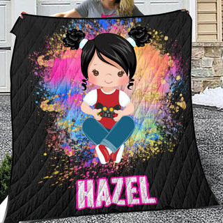 a woman holding a blanket with a picture of a girl on it