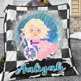 a woman holding a quilt with a picture of a girl on it